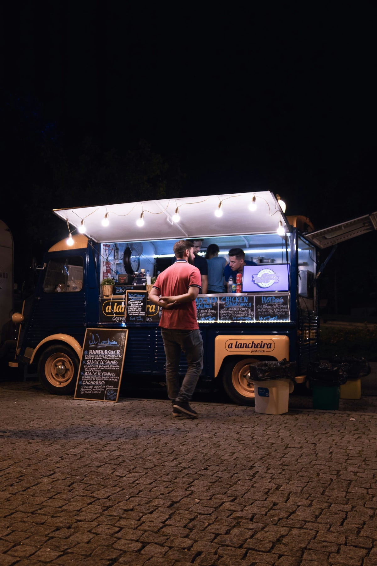 Food truck serving customers in the evening